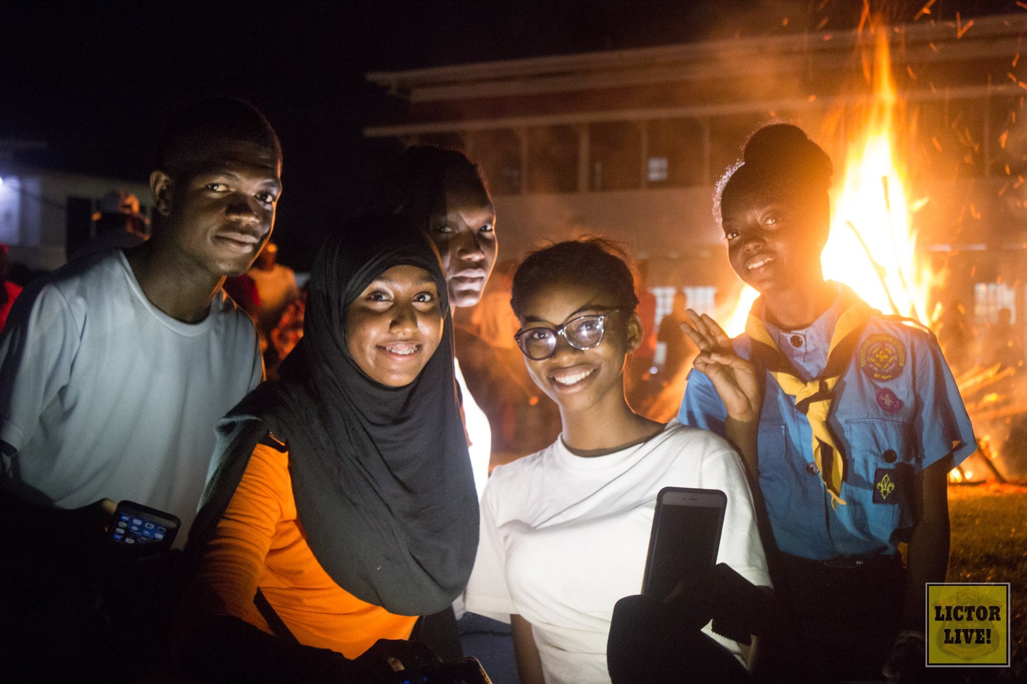 <strong>Bonfire Night at QC</strong><br>During the week of activities commemorating the 175th anniversary of the College, a Bonfire and Story-telling Night was held where alumni shared their stories with the current students around the bonfire on the Queen’s College Grounds.<br>Photo: <em>Lictor Live!</em> Bonfire Night at QC