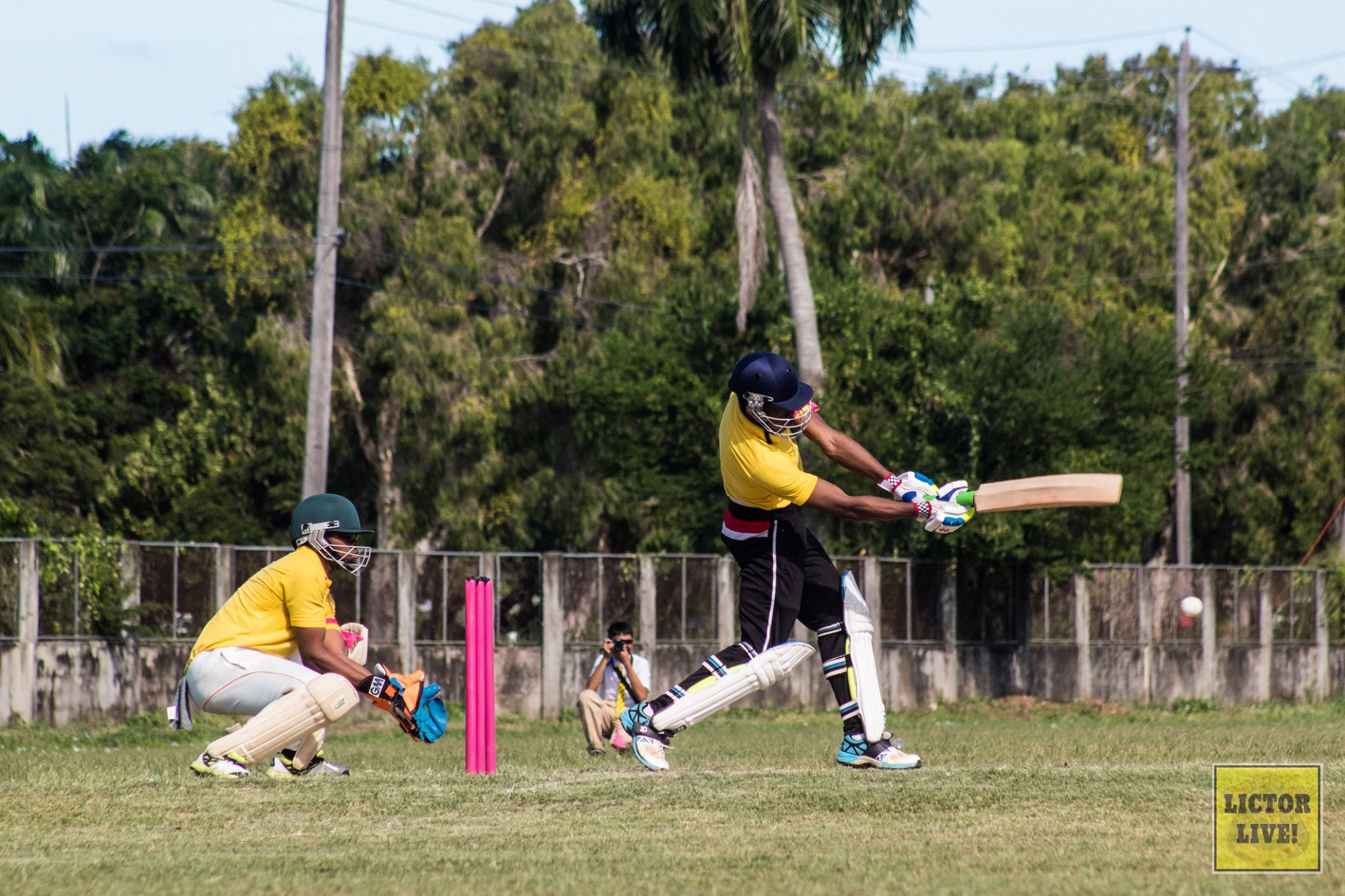 <strong>Going, going, gone!</strong><br>The Queen’s College Cricket Team plays a game of cricket on the Queen’s College Cricket Pitch in honour of Breast Cancer Awareness Month.<br>Photo: <em>Lictor Live!</em> Going, going, gone!