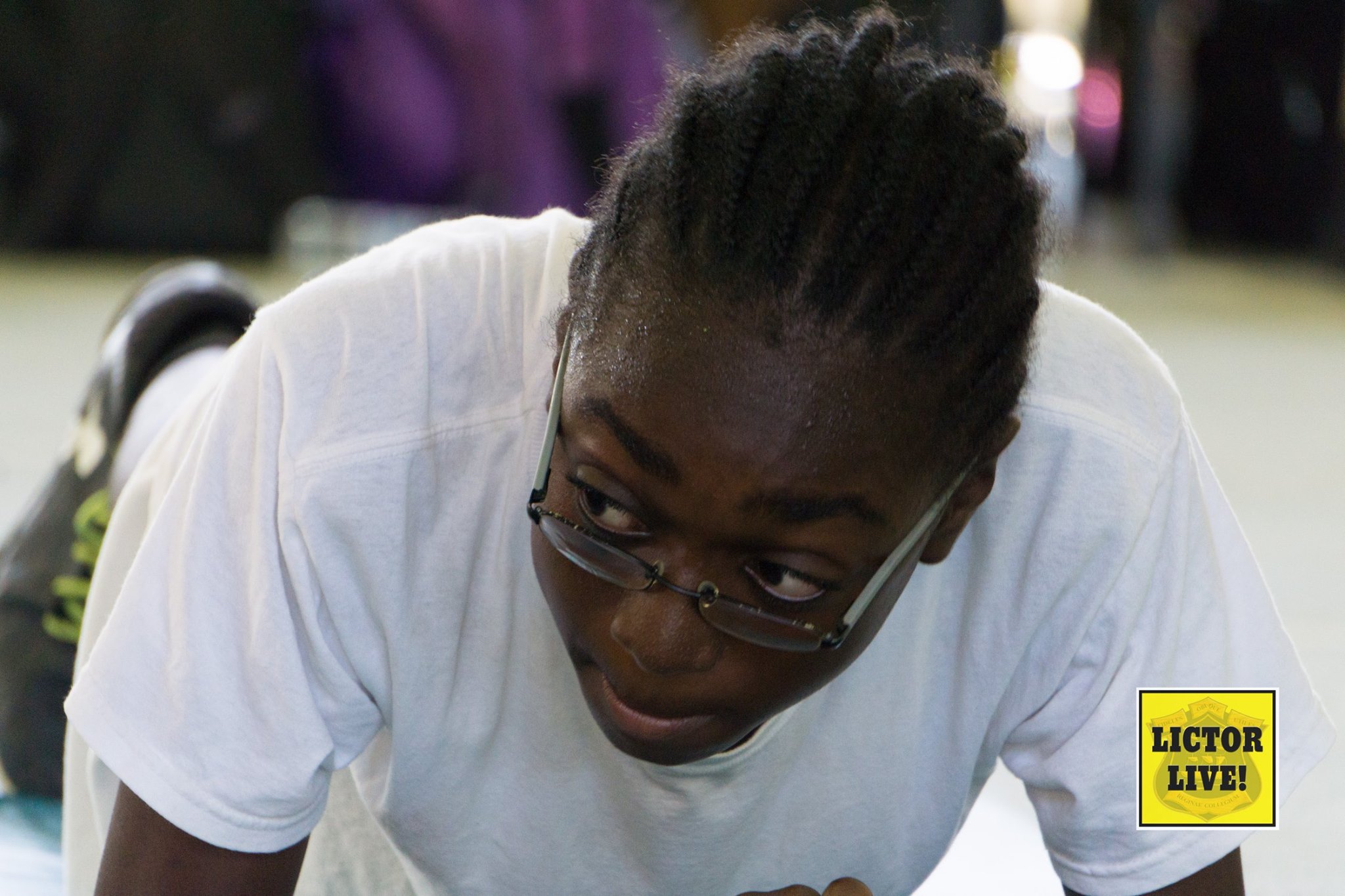 <strong></strong><br>A Third Form Wooley house member during the planks section of the 2017 Fitness Competition. In 2017, the scores obtained at the fitness competition were combined to the track and field scores to give the overall score used to determine the winners of Sports. This arrangement has since been modified.<br>Photo: <em>Lictor Live!</em>